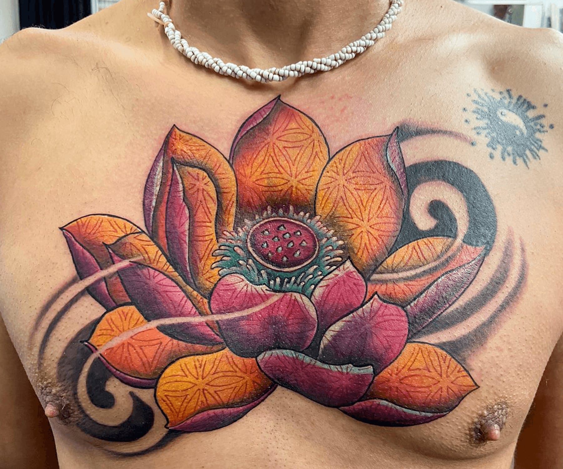 Abstract geometric lotus chest tattoo, full view